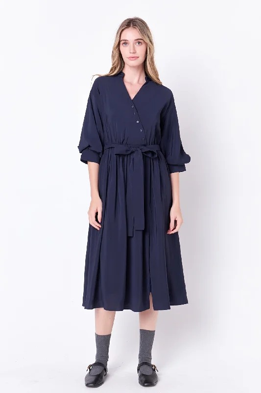 Midi dresses with geometric cutouts for a contemporary and edgy look Angled Buttoned Wrap Midi Dress Midi dresses with geometric cutouts for a contemporary and edgy look Angled Buttoned Wrap Midi Dress