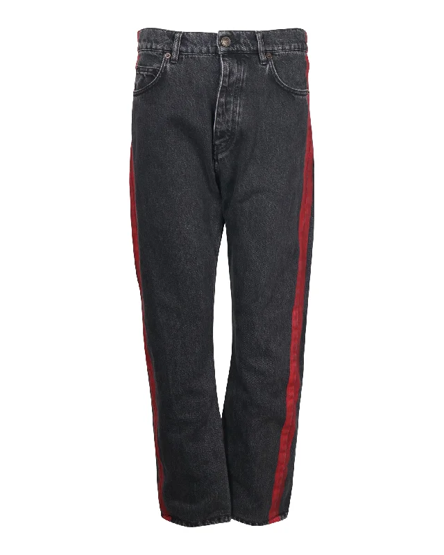Men's Jeans with a Zip - Off Lower Leg for Convertible StyleBalenciaga Denim Jeans with Red Stripe Detail in Black Cotton Men's Jeans with a Zip - Off Lower Leg for Convertible StyleBalenciaga Denim Jeans with Red Stripe Detail in Black Cotton