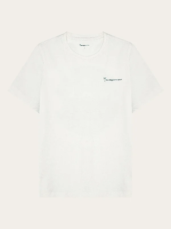 Crew Neck Women T Shirt with a Timeless DesignRegular fitted back print tee - Regenerative Organic Certified® - GOTS/Vegan - Egret Crew Neck Women T Shirt with a Timeless DesignRegular fitted back print tee - Regenerative Organic Certified® - GOTS/Vegan - Egret
