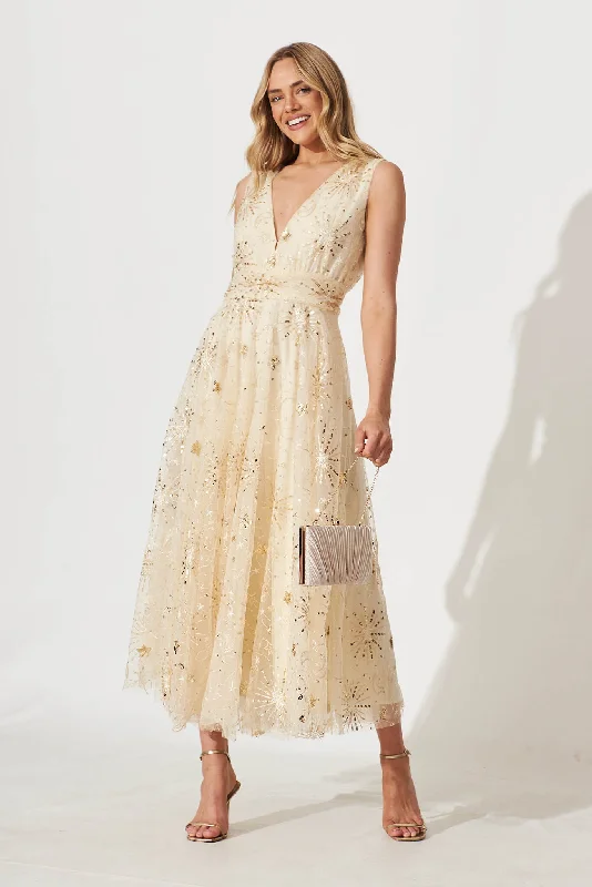 Maxi dresses with a gathered skirt for a voluminous and dramatic effectDazzle Maxi Dress In Gold Sequin Tulle Maxi dresses with a gathered skirt for a voluminous and dramatic effectDazzle Maxi Dress In Gold Sequin Tulle
